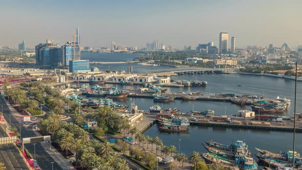 Dubai Creek Landscape Timelapse with Boats and Ship in Port and Modern Buildings in the Background alt