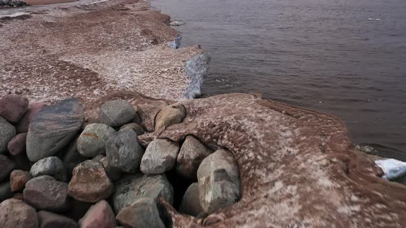 There Is Snow and Sand Along the Lake Shore. Nast with Sand From Ice and Snow on the Lake Shore