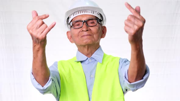 Happy senior engineering architect wearing a vest and helmet makes mini alt