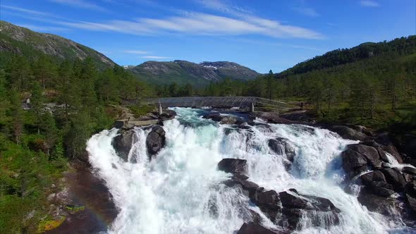 Flying close above waterfall Likholefossen in Norway alt