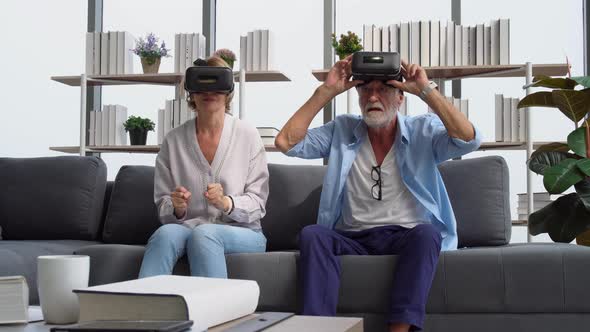 Senior couple having fun with virtual reality glasses, Happy elderly technology concepts