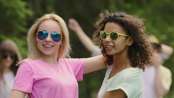 Beautiful Female Couple Hugging, Dancing, Looking Into Each Others Eyes at Party alt