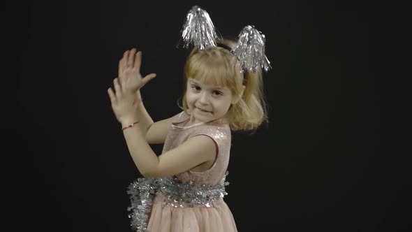 Happy Beautiful Little Baby Girl in Glossy Dress. Christmas. Make Faces, Dance alt