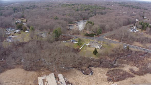 Aerial Drone Shot of New Power Lines and Suburbs Cutting Through Former Farmland alt