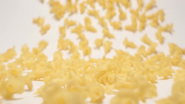 Stream Of Curly Pasta Moving To A Camera