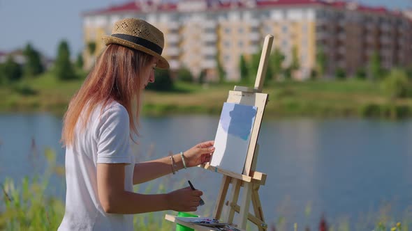 Female Painter is Drawing Plein Air Spending Free Time with Creative Hobby alt