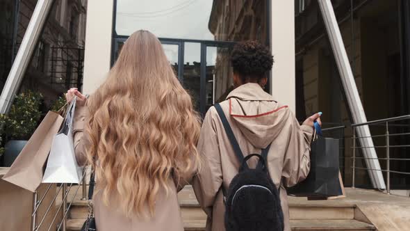 Beautiful Girls Holding Shopping Bags Going to the Mall alt