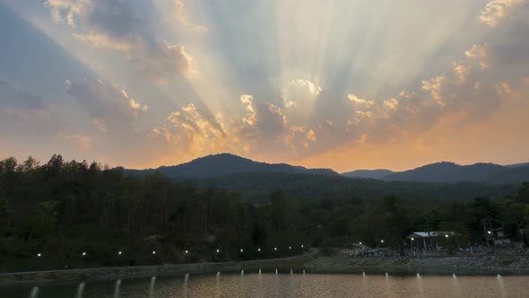 Time lapse of Clouds and sunbeam mountain and reservoir in evening.