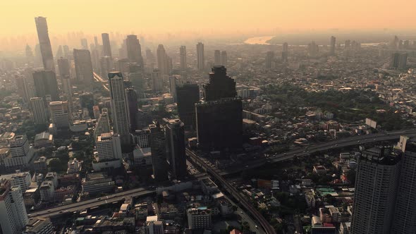 4k Aerial city view of Bangkok dowtnown, Flying over Bangkok, Thailand. alt