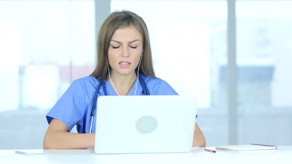 Young Female Doctor Talking with Patient, Online Video Chat on Laptop alt