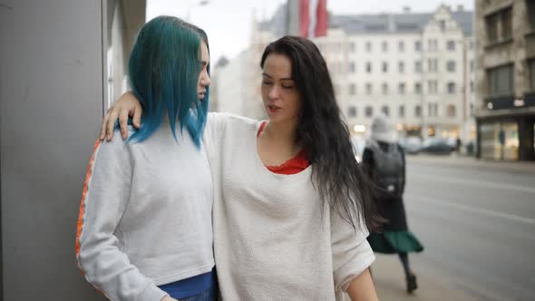 Young Lesbian Woman Jumps on Her Girlfriend and Smiles alt