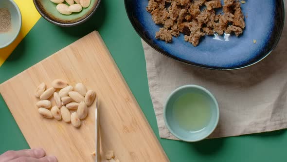 Vertical Flat Lay Video Chef Cookes Meal with Cutted Almonds