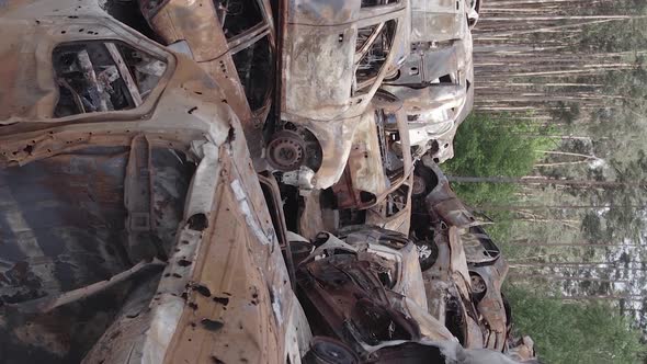 Vertical Video of a Dump of Destroyed Cars During the War in Ukraine alt