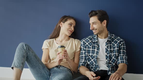 Handheld video of young couple in their new empty house. Shot with RED helium camera in 8K alt