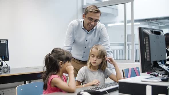 Multiethnic Girls Trying to Cope with Task on Computer Science alt