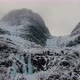 Aerial view of a mountain in Lyngen Alps with frozen waterfalls, Norway, Arctic - VideoHive Item for Sale