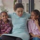 Joyful Black Mom and Daughters Having Fun on Couch - VideoHive Item for Sale