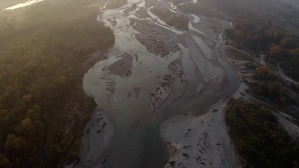 Aerial view of Laba river valley at dawn in autumn, trees, stony coast, Mostovskoy, Caucasus Russia alt