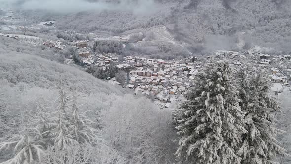 Krasnaya Polyana Village Surrounded By Mountains Covered with Snow alt