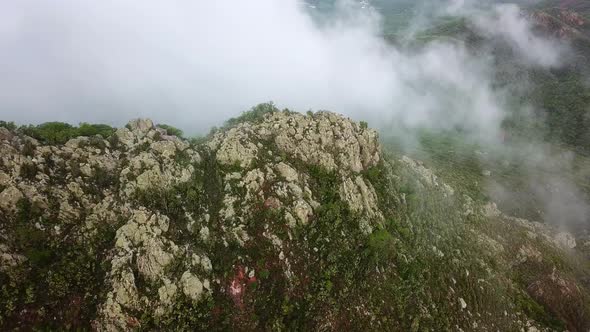 Aerial view dolly in tilt down of Mount Cristobal (Christoffelberg), the only mountain on the Dutch alt