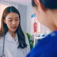 Asian specialist doctor and assistant nurse take care of male patient. - VideoHive Item for Sale
