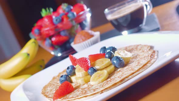 Tasty Breakfast of Pancakes and Fruit on the Table alt