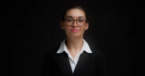 Business Woman with Glasses with a Serious Face Shows Seven Finger