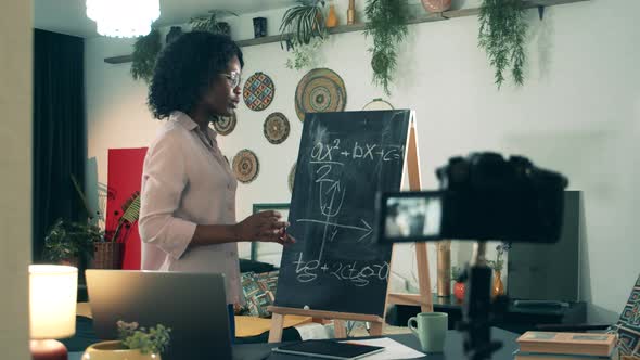 Video Lesson Is Getting Done By an African-american Lady at Home During Coronavirus Pandemic. alt