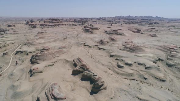 Aerial View of Sandy Rocks Desert in the World Town of Demons of Karamay, Xinjiang, China alt