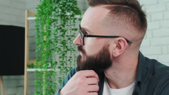 Close Up of a Young Man Resting at Home and Thinking About the Future alt