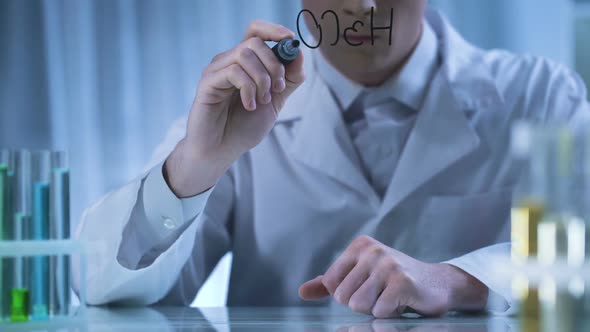 Scientist Writing Chemical Formula on Transparent Board, Pharmaceutical Research alt