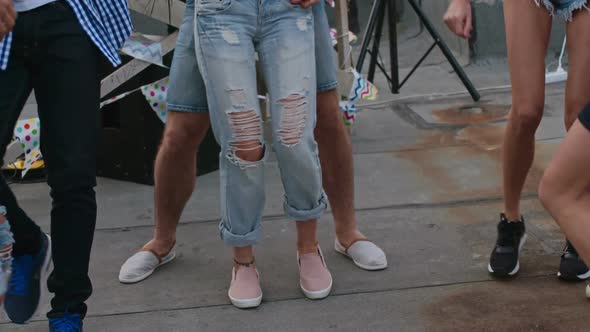 Sensual Couple Dancing Surrounded by Friends alt