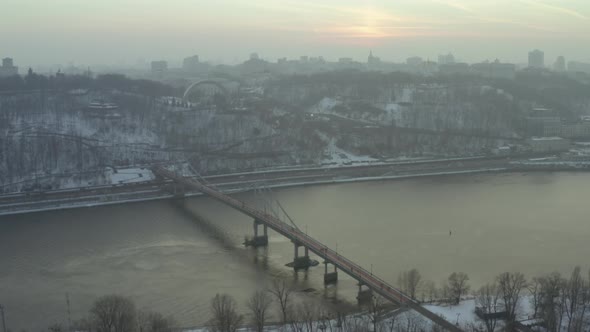 Aerial View Bridge Across River and the Arch of Friendship of Peoples in Kyiv