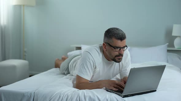 Man Rubbing Eyes Tired of Laptop, Freelancer Working on Project, Deadline Stress alt