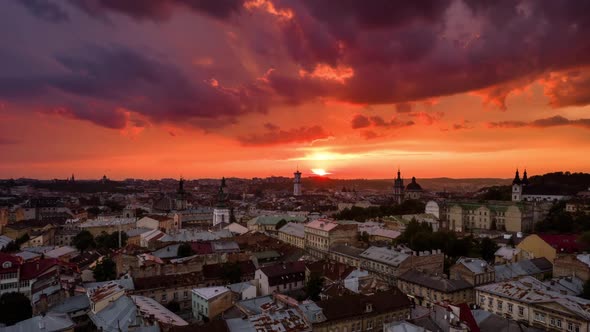 Aerial Hyperlapse Flying Above Cityscape Skyline in Lviv, Ukraine at Sunset