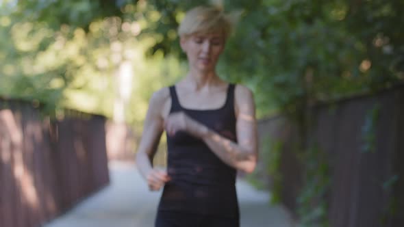 Athletic Strong Active Woman Slim Lady Runner Female Jogger Trainer Sportswoman Running in Park on alt