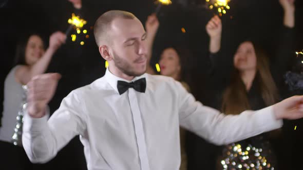 Man with Sparkler Dancing at Party alt
