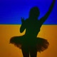 Back View Silhouette of Graceful Talented Ballerina Raising Hands at Background of Ukrainian Flag - VideoHive Item for Sale