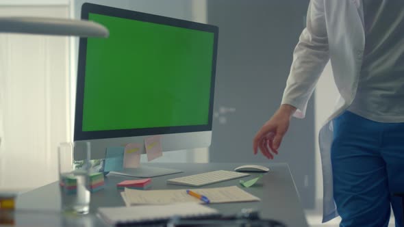 Green Screen Computer Monitor on Online Meeting Doctor Working Clinic Close Up alt