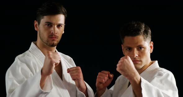 Men practicing karate alt