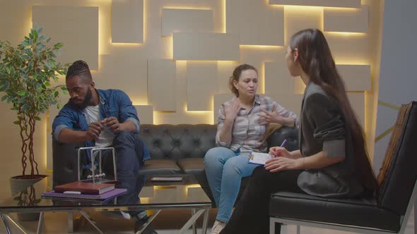 Multiethnic Couple in Crisis Trying to Solve Problems During Psychotherapy alt