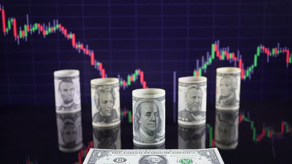 American Dollars Against The Background Of Stock Market Financial Data 1.