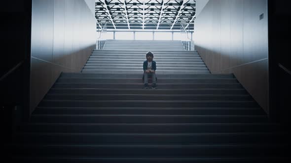 Stressed Schoolboy Stay Alone on Stairway Close Up alt