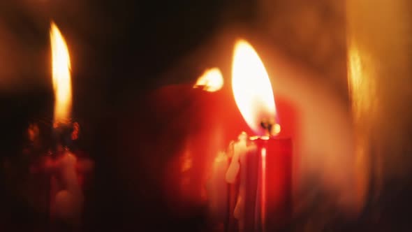 Close-up of candles burning alt