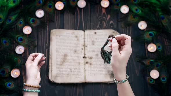 Woman Reading Mantras or Prayers From Ancient Holy Book Counts Malas Strands of Wooden Beads Used alt