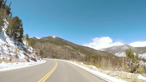 POV point of view -Driving through Rocky Mountain National Park in the Spring. alt