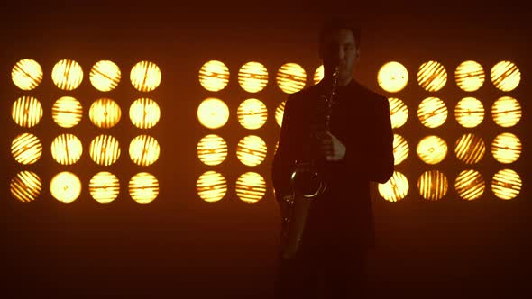 Talented Saxophonist Playing Instrument on Stage alt