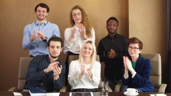 Satisfied Diverse Office Workers Clapping Hands After Business Seminar alt