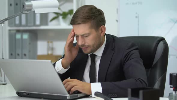 Company Head Working on Laptop Pc, Suddenly Feeling Strong Headache, Health