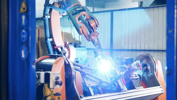 Industrial Machine Is Welding a Bicycle Carcass alt